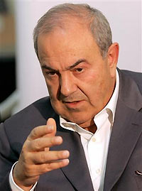 Former Iraqi prime minister Iyad Allawi gestures while answering questions during an interview in Baghdad December 4, 2005.