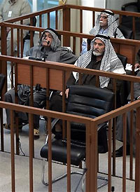 The chair of former Iraqi President Saddam Hussein remains empty during his trial in Baghdad, December 7, 2005.