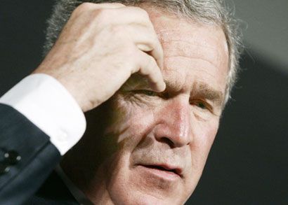 U.S. President George W. Bush ponders a question after delivering remarks on the global war on terror at Johns Hopkins University in Washington, April 10, 2006.
