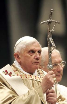 Pope Benedict XVI holds his pastoral staff as he celebrates midnight mass in St. Peter's Basilica at the Vatican December 25, 2006.